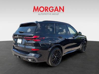 2026 BMW X5 — rear three-quarter view