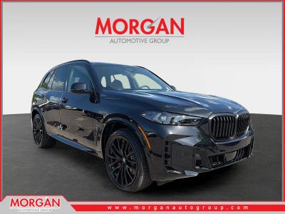 2026 BMW X5 xDrive40i in Black Sapphire Metallic — front three-quarter view