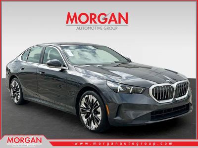 2026 BMW 5 Series 530i in Dark Graphite — front three-quarter view