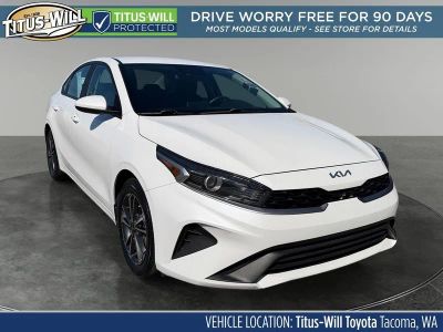 2023 Kia Forte LXS in Snow White Pearl — front three-quarter view