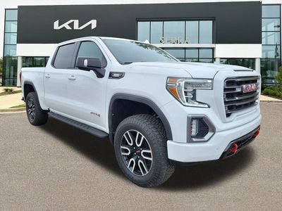 2021 GMC Sierra 1500 AT4 in Summit White — front three-quarter view
