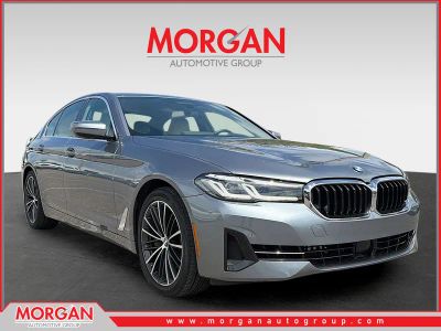 2021 BMW 5 Series 540i in Bluestone Metallic — front three-quarter view