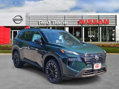 2026 Nissan Rogue Dark Armor in Obsidian Green — front three-quarter view