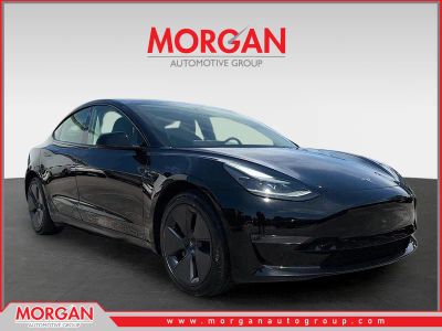 2023 Tesla Model 3 Base in Solid Black — front three-quarter view
