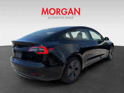 2023 Tesla Model 3 — rear three-quarter view