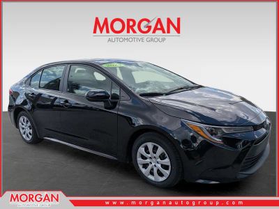 2024 Toyota Corolla LE in Midnight Black Metallic — front three-quarter view