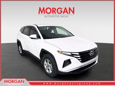 2023 Hyundai Tucson SE in White Pearl — front three-quarter view