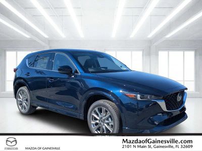 2025 Mazda CX-5 2.5 S Premium Plus Package in Blue — front three-quarter view