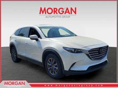 2023 Mazda CX-9 Touring in Snowflake White Pearl Mica — front three-quarter view