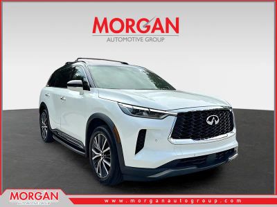 2023 INFINITI QX60 AUTOGRAPH in Majestic White/Black Obsidian — front three-quarter view
