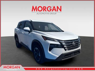 2024 Nissan Rogue SV in White Pearl — front three-quarter view