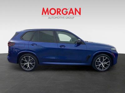 2026 BMW X5 — rear three-quarter view