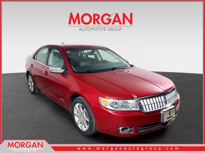 2009 Lincoln MKZ Base in Red — front three-quarter view