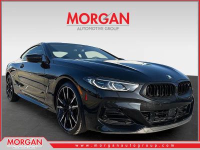2024 BMW 8 Series M850i xDrive in Black Sapphire Metallic — front three-quarter view