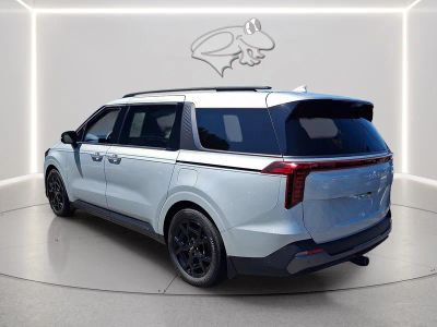 2025 Kia Carnival — rear three-quarter view