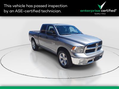 2024 Ram 1500 Classic SLT 4x4 Quad Cab 6'4" Box — front three-quarter view