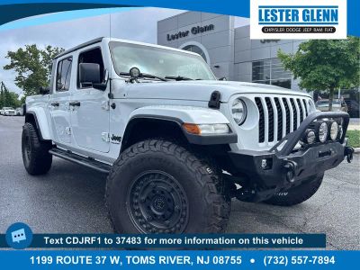 2023 Jeep Gladiator Sport S in Bright White Clear Coat — front three-quarter view