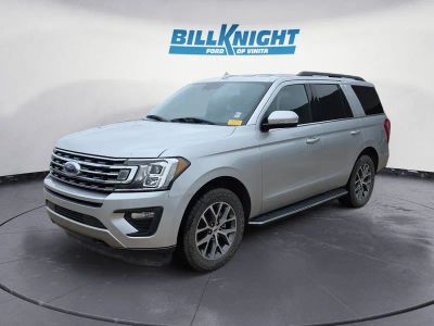 2018 Ford Expedition XLT in Ingot Silver Metallic — front three-quarter view
