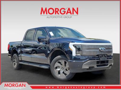 2023 Ford F-150 Lightning Lariat in Blue — front three-quarter view
