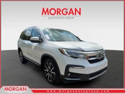 2022 Honda Pilot Touring in White — front three-quarter view