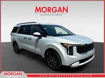 2026 Kia Carnival Hybrid EX in Silver — front three-quarter view