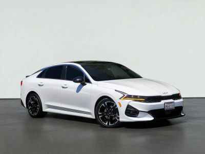 2022 Kia K5 GT-LINE in Glacial White Pearl — front three-quarter view