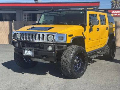 2003 Hummer H2 in Yellow — front three-quarter view
