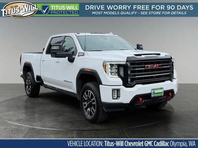 2021 GMC Sierra 2500 HD AT4 in Summit White — front three-quarter view