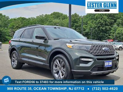 2022 Ford Explorer XLT in Forged Green Metallic — front three-quarter view