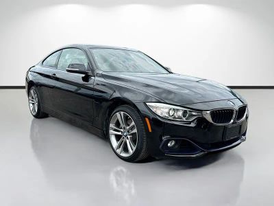 2015 BMW 4 Series 428i xDrive in Black — front three-quarter view