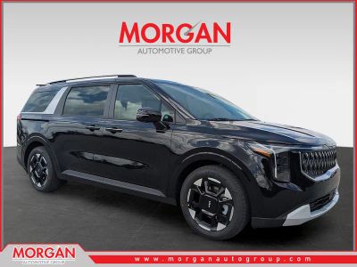 2026 Kia Carnival EX in Aurora Black Pearl — front three-quarter view