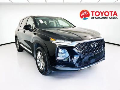 2020 Hyundai Santa Fe SE in Twilight Black — front three-quarter view