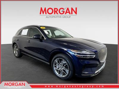 2025 Genesis GV70 2.5T in Capri Blue — front three-quarter view
