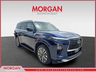 2025 INFINITI QX80 LUXE in Grand Blue — front three-quarter view