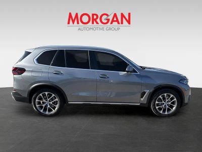 2026 BMW X5 — rear three-quarter view