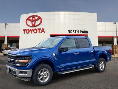 2024 Ford F-150 XLT in Atlas Blue Metallic — front three-quarter view