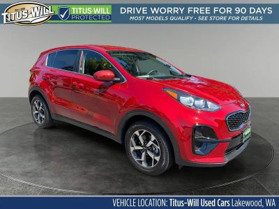 2020 Kia Sportage LX in Red — front three-quarter view