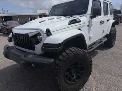 2024 Jeep Wrangler Sahara in White — front three-quarter view