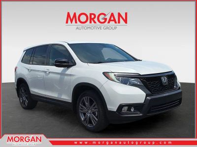 2021 Honda Passport EX-L in Platinum White Pearl — front three-quarter view