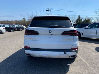 2026 BMW X5 — rear three-quarter view