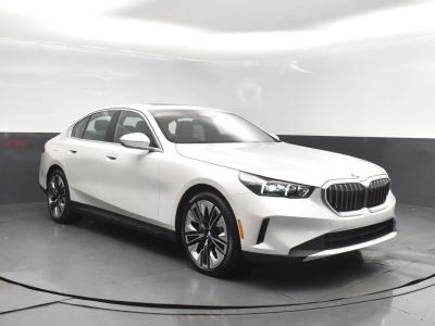 2026 BMW 5 Series N/A in White Metallic — front three-quarter view