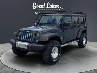2017 Jeep Wrangler Unlimited Sport in Rhino Clearcoat — front three-quarter view