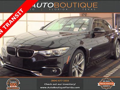 2019 BMW 4 Series 430i xDrive in Black Sapphire Metallic — front three-quarter view
