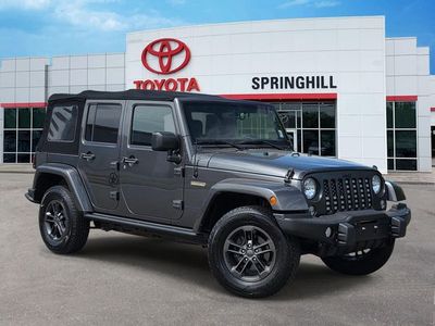 2018 Jeep Wrangler JK Unlimited Sport — front three-quarter view