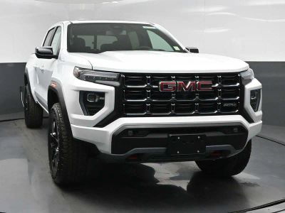 2026 GMC Canyon AT4 in Summit White — front three-quarter view