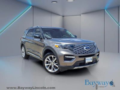 2021 Ford Explorer Platinum in Stone Gray Metallic — front three-quarter view