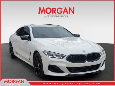 2023 BMW 8 Series M850i in Mineral White Metallic — front three-quarter view