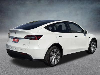 2023 Tesla Model Y — rear three-quarter view