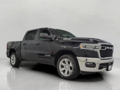 2025 RAM 1500 Big Horn Crew Cab 4x4 5'7" Box in Diamond Black Crystal Pearlcoat — front three-quarter view
