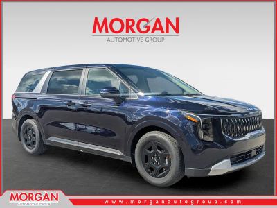 2026 Kia Carnival LXS in Deep Chroma Blue — front three-quarter view